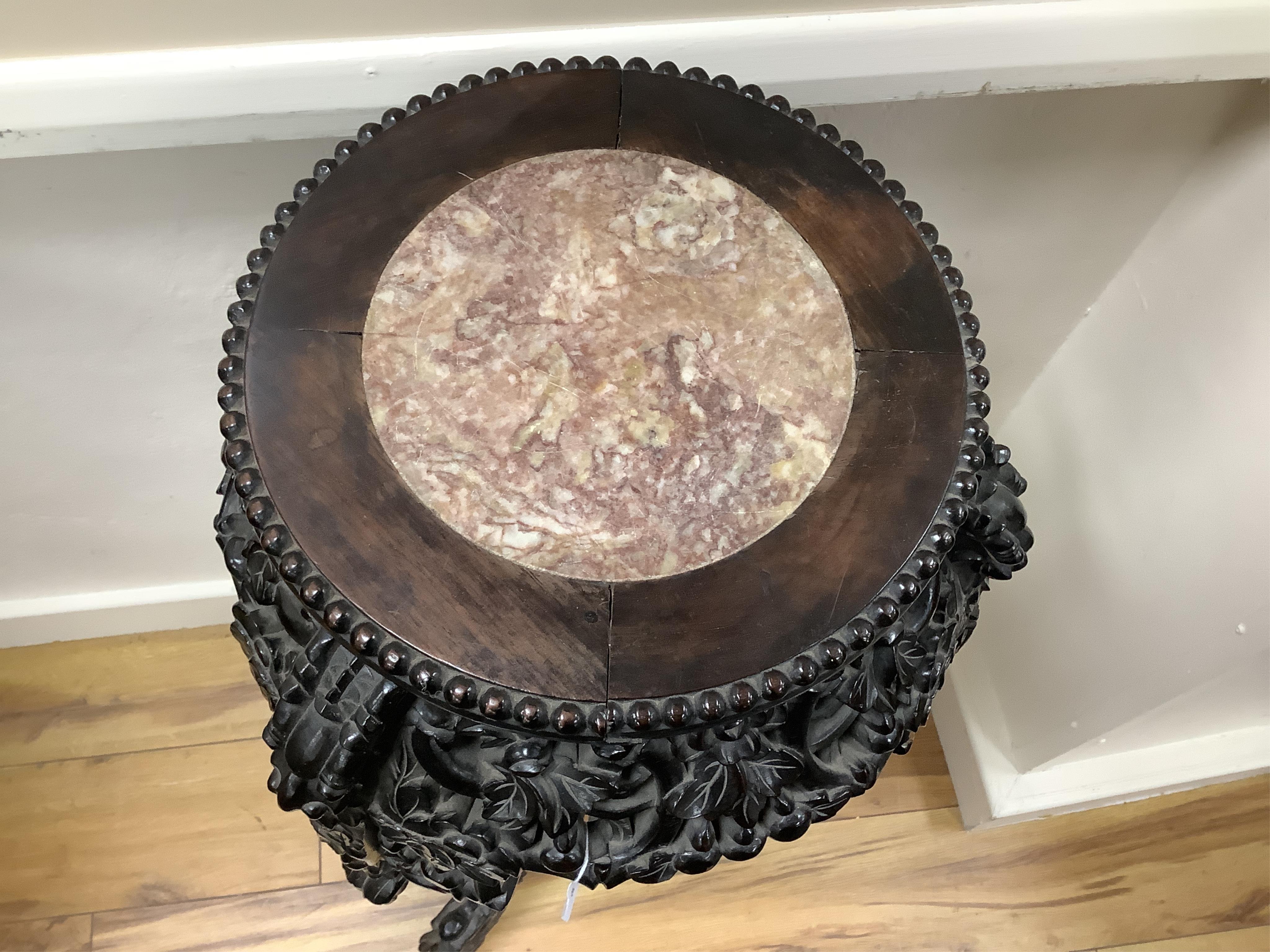 A Chinese marble topped vase stand, diameter 34cm, height 94cm